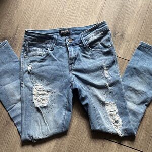 Bebe Light Blue Skinny Jeans with Distressed Details